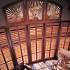 Dramatic sunburst arches with wood shutters