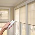 Motorized roller shades with hand-held remote